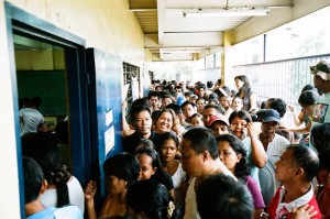 Teacher acting as a board of elections inspector (BEI) gives instructions to crowds waiting to vote.   PHOTOS: JOSEPH SMOOKE